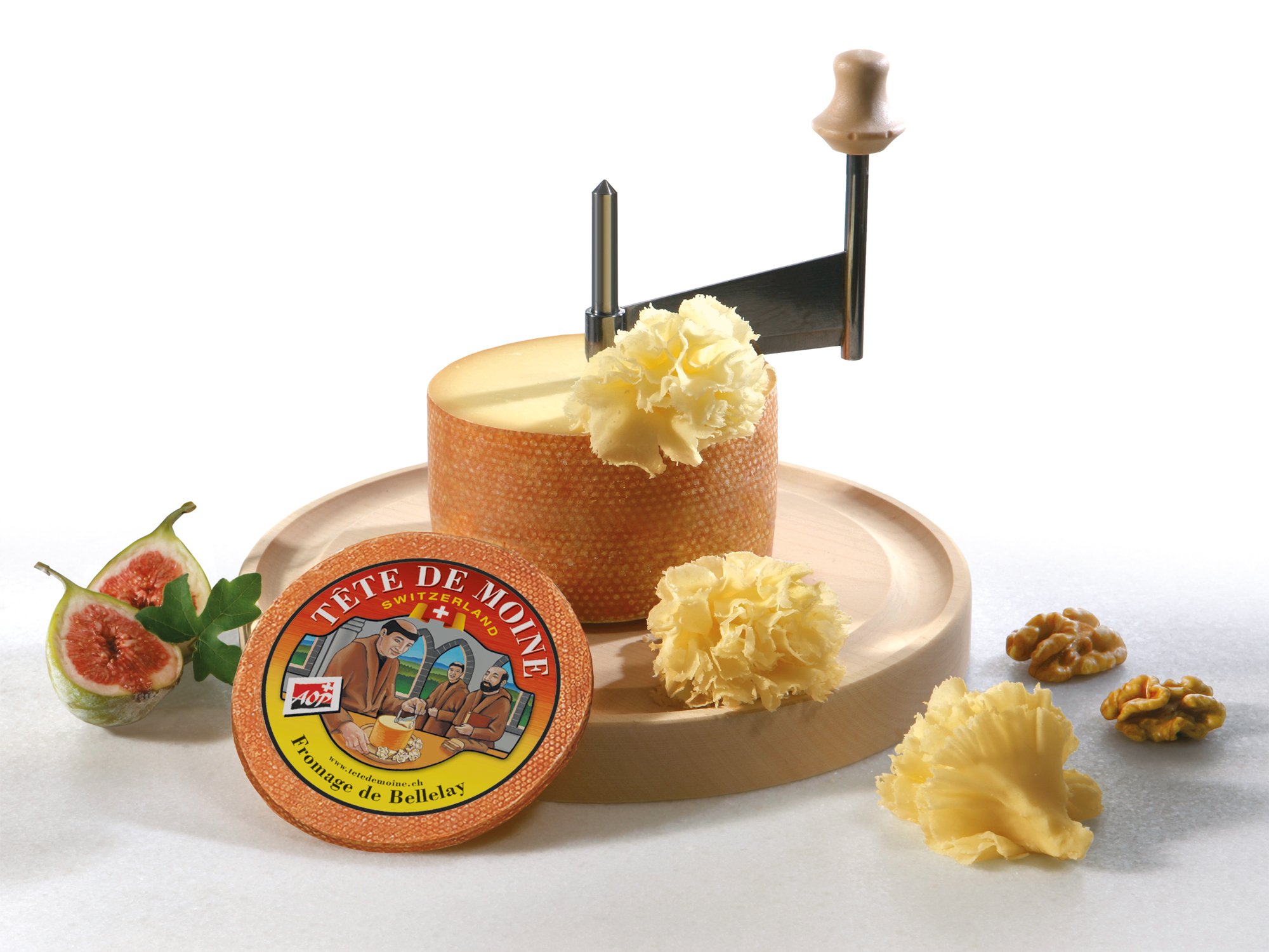 Shaving Tete De Moine Cheese Using Girolle Knife. Variety Of Swiss  Semi-hard Cheese Made From Unpasteurized Cows Milk, The Name Monks Head  Stock Photo, Picture and Royalty Free Image. Image 166728765.