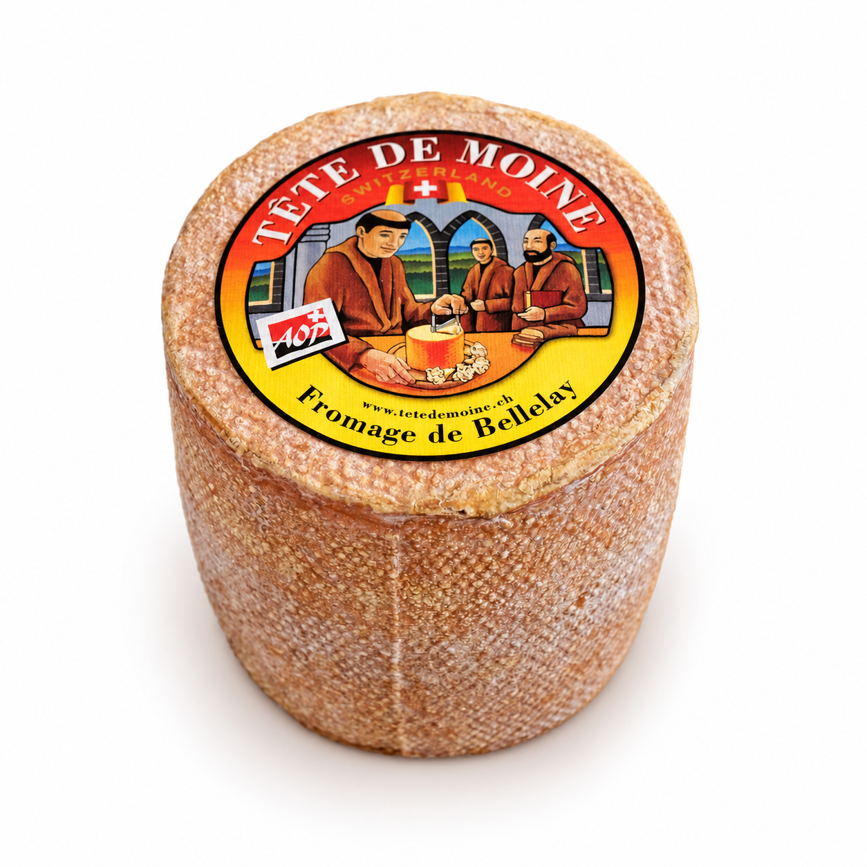 Whole wheel of Tête de Moine AOP Swiss cheese with its traditional Fromage de Bellelay label.