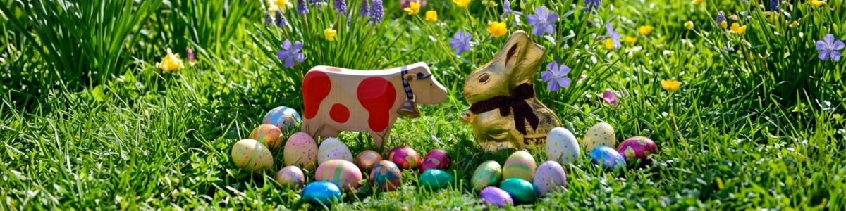 Swiss wooden red cow meeting chocolate Easeter bunny